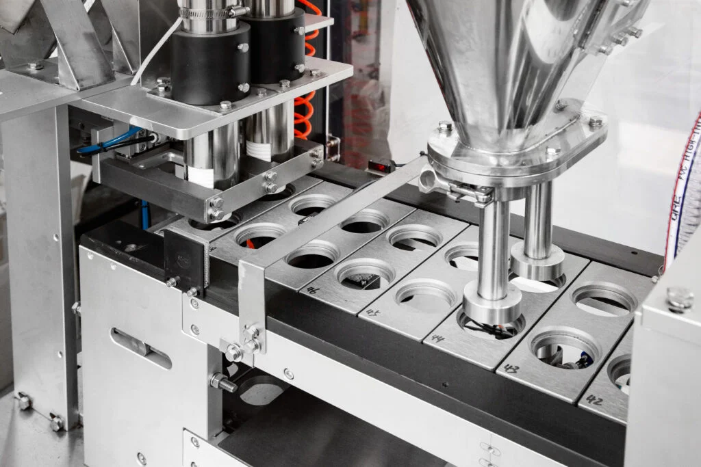 stazione di riempimento della macchina sigillatrice per riempimento Nespresso