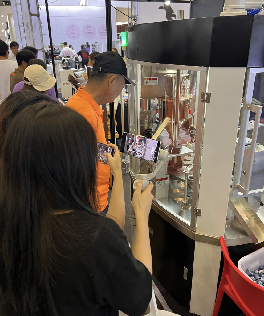 tourists were captivated by the mesmerizing operation of AFPAK's coffee capsule filling machine